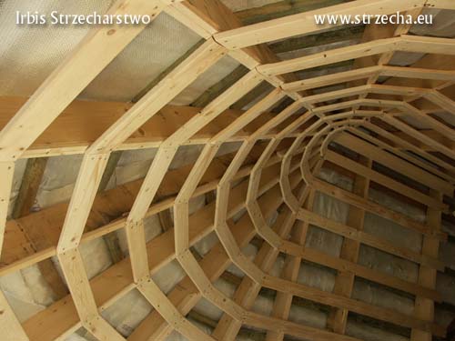 A built-in winter garden covered with thatched roofs, preparation for covering with gypsum boards, after laying mineral wool insulation