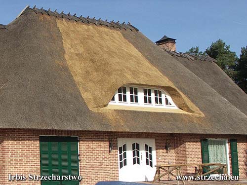 Thatch - modernization of the house often makes alterations to the roof surface - here resizing windows with wooden structure reworking